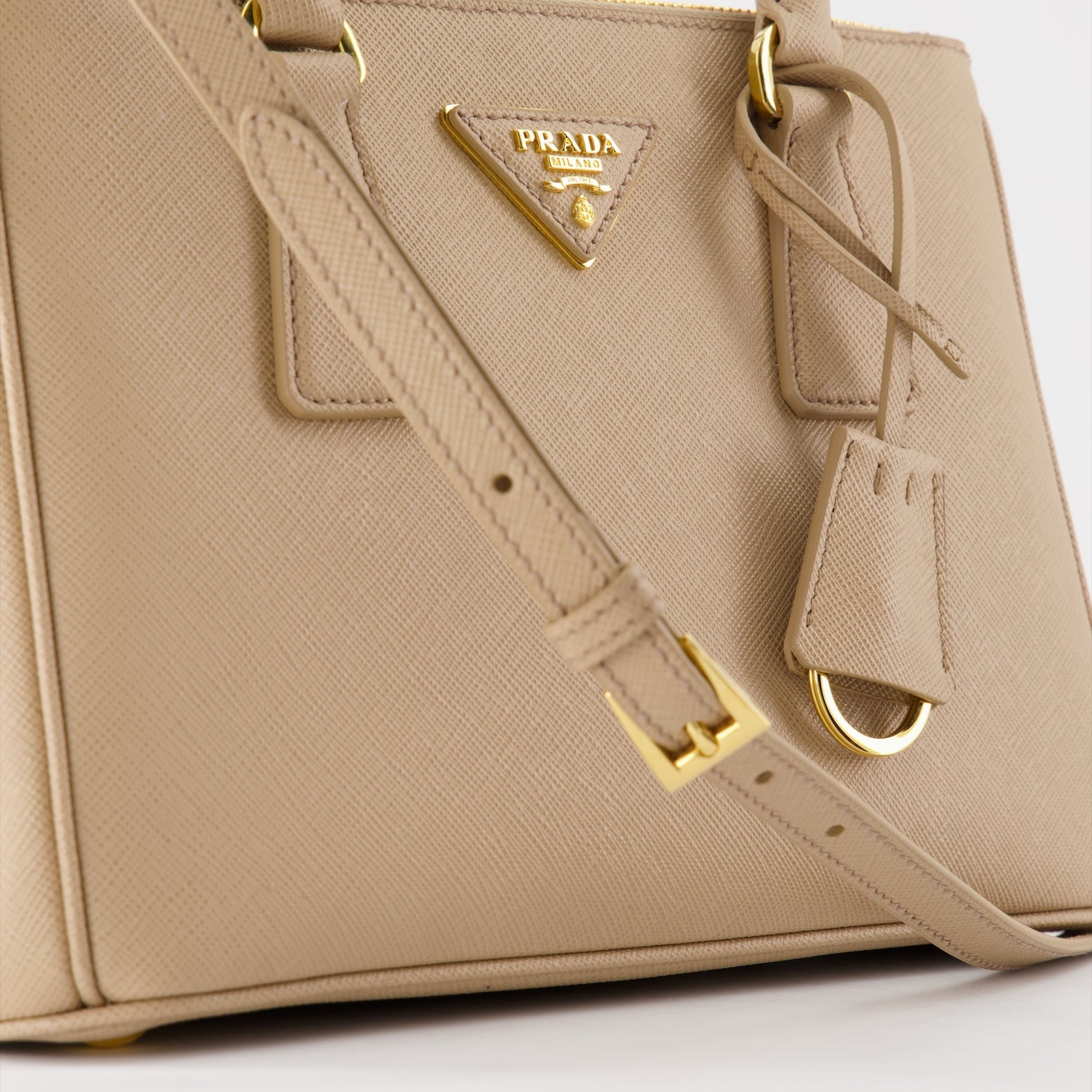 Prada handbag, Saffiano leather, luxury women's bag, beige handbag, high-end accessory