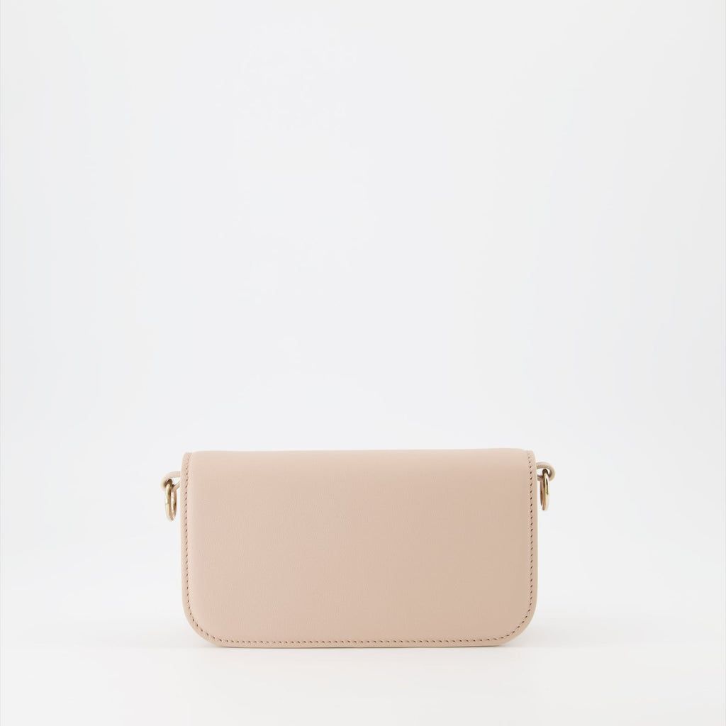 beige handbag, luxury bag, Valentino Garavani, designer accessory, elegant handbag