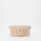 beige handbag, luxury bag, Valentino Garavani, designer accessory, elegant handbag