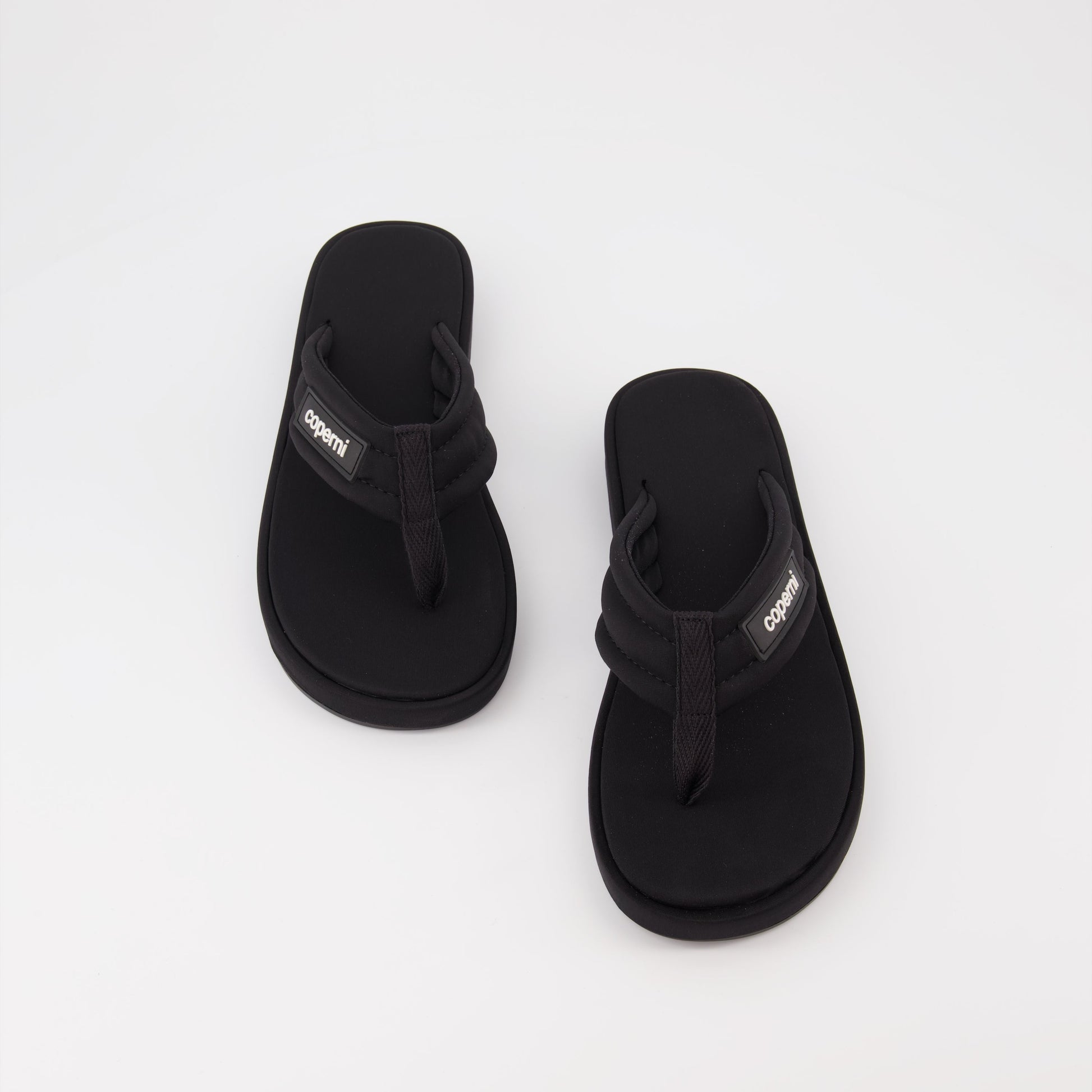 Coperni flip-flops, black logo sandals, luxury beachwear, stylish summer footwear, premium casual sandals