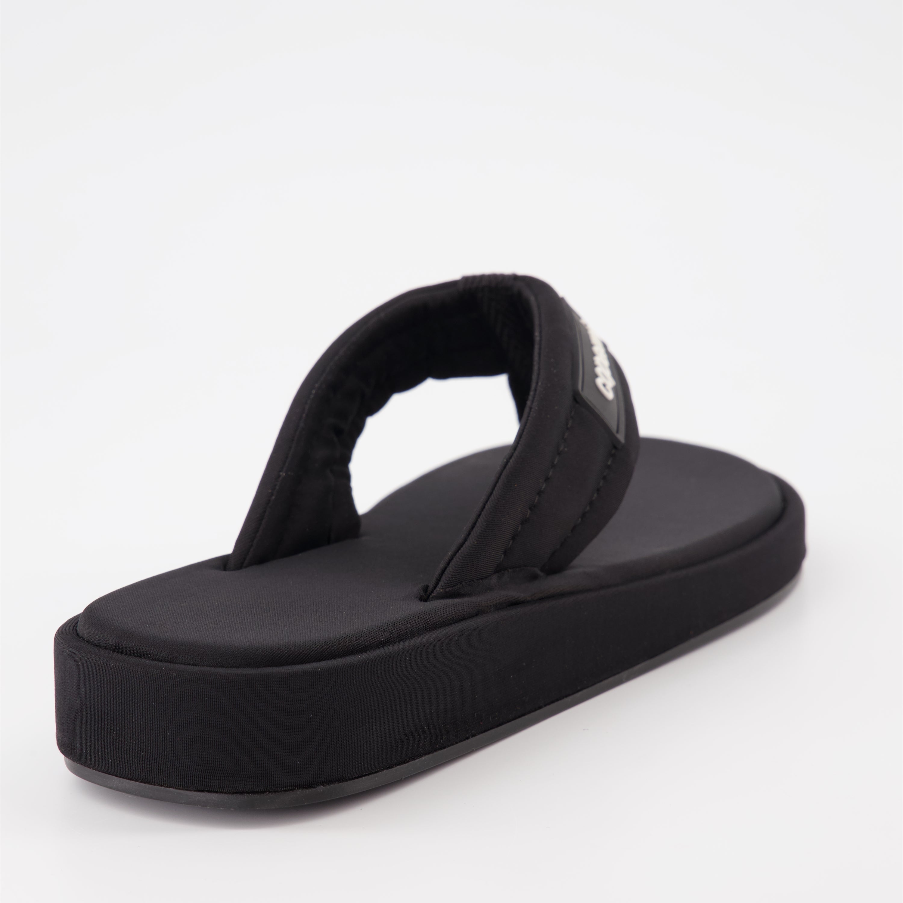 Coperni flip-flops, black logo sandals, luxury beachwear, stylish summer footwear, premium casual sandals