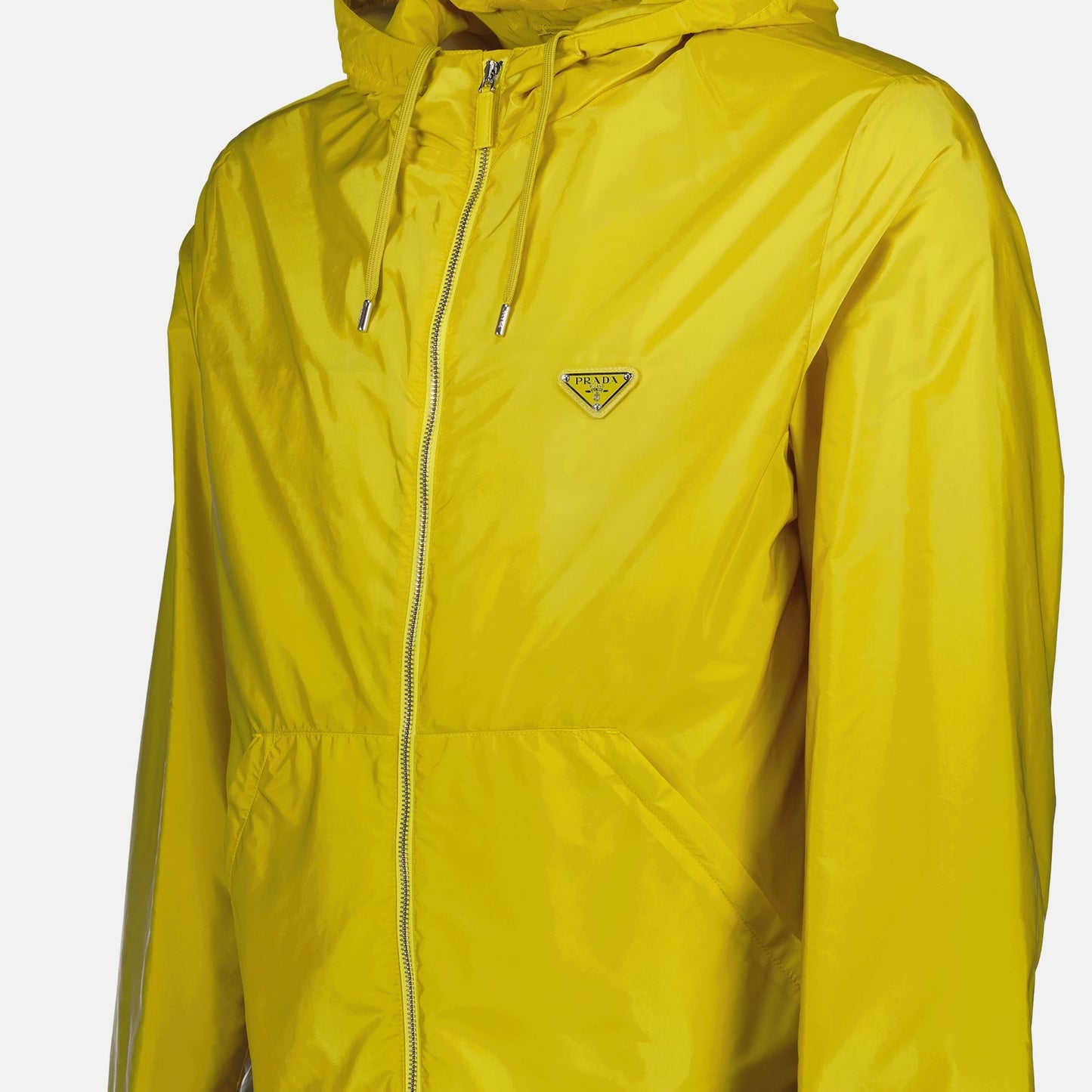 Prada windbreaker, yellow nylon jacket, men’s luxury outerwear, Prada Re-Nylon, sustainable fashion